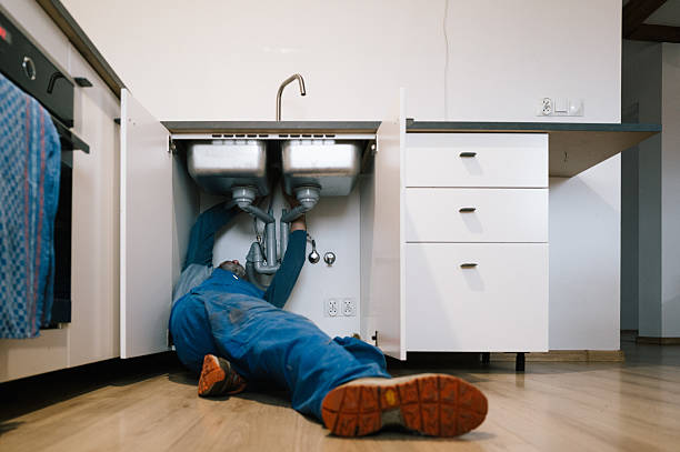 Professional Emergency Plumber technician working in Bellport, NY